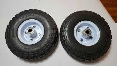 These are two used 4.10/3.50-4 tires, This is a solid tire that does not require air. It is used and...