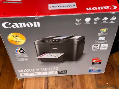 This Canon Printer is Like New in the Box It was used TWICE to print out some price tag labels We pa...