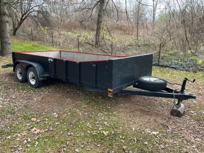 This heavy duty trailer has a beaver tail, ramps, electric brakes on both axles, all around LEDs and...
