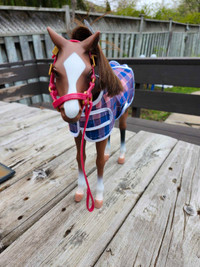 Toy horse. Still has hair separator attached. 