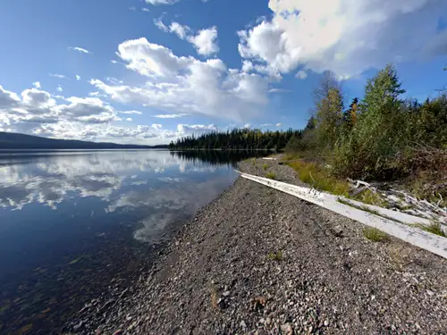 Rare opportunity to own a private 9.5 acre waterfront parcel on beautiful Binta Lake in the scenic L...
