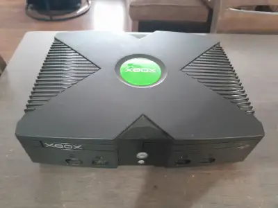 Selling an adult owned Soft modded xbox. Running XBMC4Gamers. It has about 55 games installed on con...