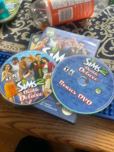 Dive into the captivating world of The Sims 2 Double Deluxe with this PC game! This edition comes co...
