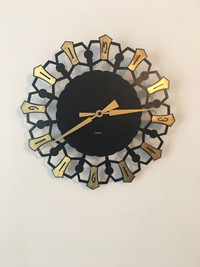 Vintage unique Germany quartz wall clock. 12” diameter.