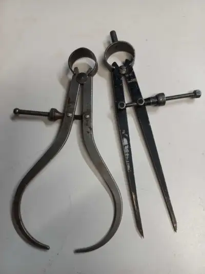 This used caliper set includes both an inside and outside caliper, perfect for precise measurements...