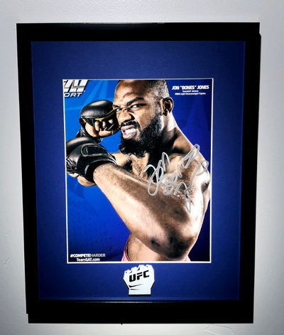 UFC Goat aaaand NEW!!! Heavyweight Champion of the World, Jon "Bones" Jones signed 8.5"x11" promo ph...