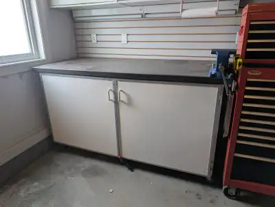 Solid, shop-built workbench in great working condition. Built from a welded steel frame with a thick...
