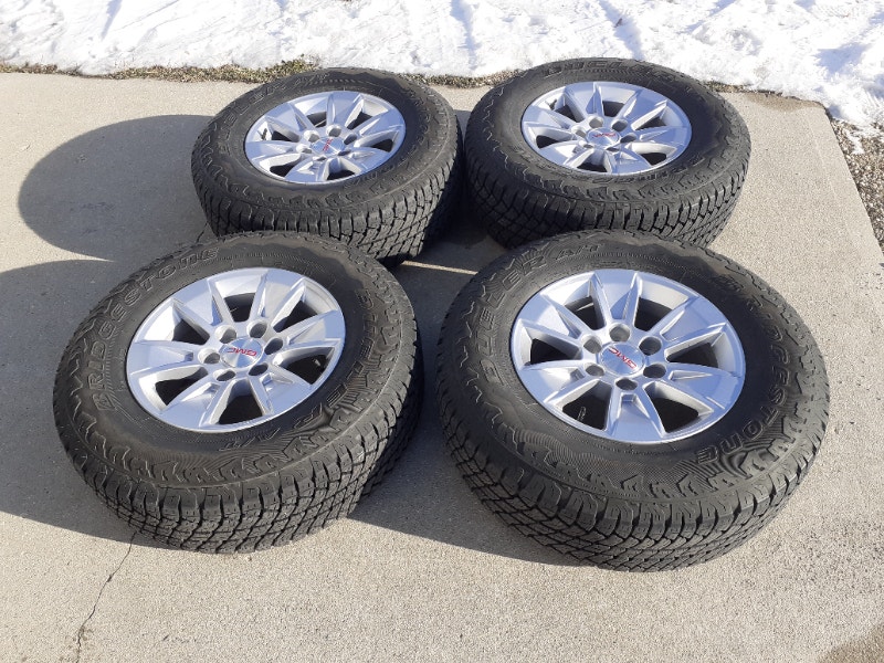 4 = 2019 GMC RIMS 6X139.7 w/ BRIDGESTONE DUELER A/T 265 70 R17 Tires