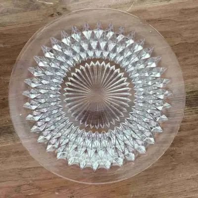 11” in diameter. Good condition. Note that this plate is not flat. It has a depression in the centre...