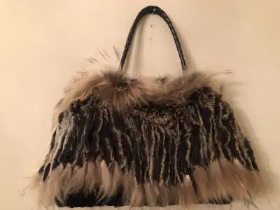 Handbag. Beautiful fur tote handbag. Measures 17" X 11" with 10" drop handle. Ample storage compartm...