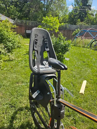 THULE rear mount child bike seat In excellent condition Mounts to a bike frame Can be adjustable ver...