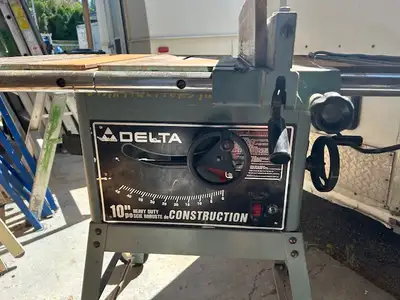 Delta 10” heavy duty construction table saw. Cast iron table.