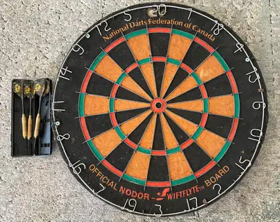 For sale a National Darts Federation of Canada dartboard and 2 sets of 3 darts each. The dartboard i...