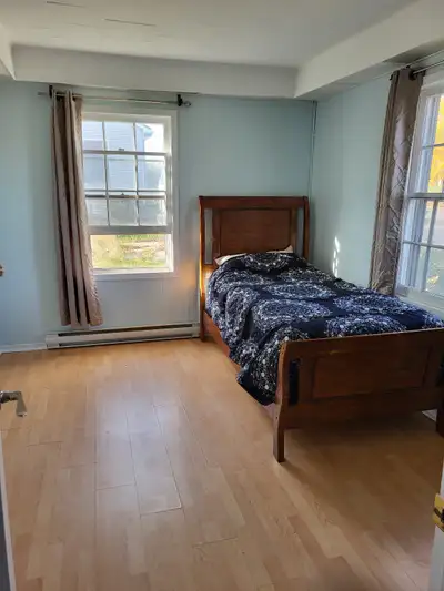 Furnished large bedroom in shared house. The photo of the bedroom is another room in the house, as t...