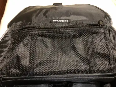 Black New...never used Excellent condition. Two internal compartments With Velcro Pouch on inside li...