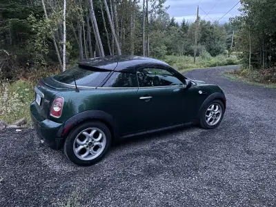 This pre-owned MINI Cooper Coupe offers a unique and sporty driving experience, featuring an iconic...