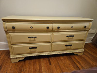 Two wood nightstands and a matching chest of drawers