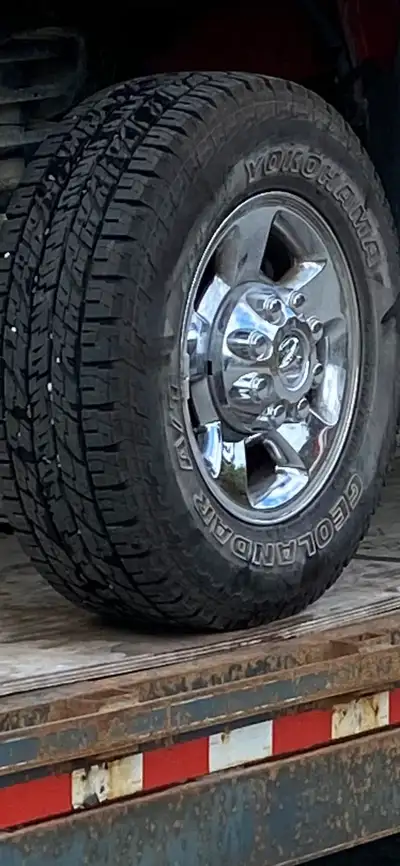 Near new Geolanders on factory aluminum wheels. complete with all caps and hardware. Excellent condi...