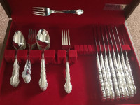 Partial 1881 Rogers Silverware (cutlery) with Flirtation pattern