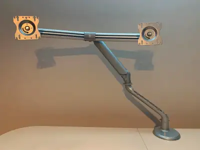 Dual Monitor Arm in very good condition. Silver color, elegant design. Perfect condition of the prod...