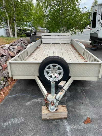 Model: UATS8516DR (82” x 16') Premium All-Aluminum Tandem-Axel Utility Trailer. In Very Good Conditi...