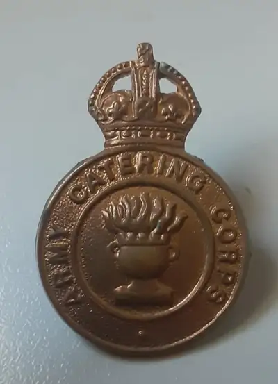 British Army Catering Corps cap badge. Information about the badge and the Corps includes: The Army...