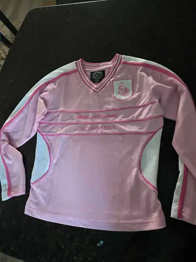 Ottawa Sens pink youth medium hockey jersey. Like new, only worn once. Mix and match with items from...