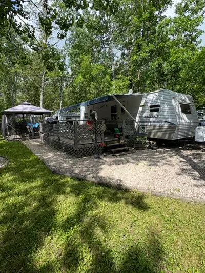 2004 Springdale by Keystone 29FK RV Trailer on a seasonal lot located at Spruce Sands RV Resort just...