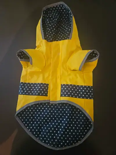 Dog raincoat, will fit small to medium dog, brand new... $20.