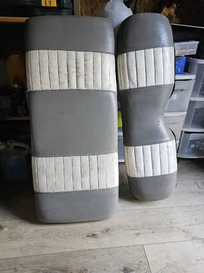 These are a set of used EZ Go golf cart seat covers with a grey and white striped design, ready to a...