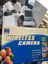 2 wireless cameras with handheld viewer