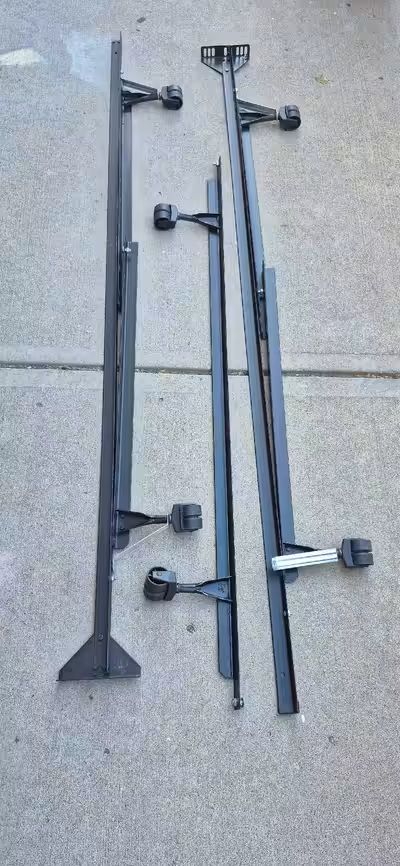 Metal bed frame with rollers