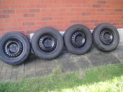 Goodyear Ultragrip winter tires , 195/65R15 , with ford rims 5x108mm bolt pattern , about 75% thread...