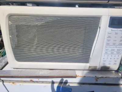 Vintage white sensor cooking microwave. Kitchen appliance., View more