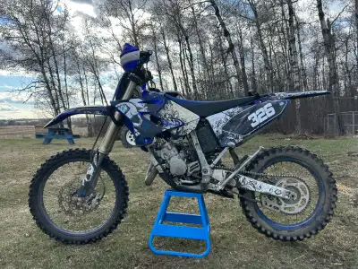 2021 YZ125X has ASV levers, handguards, AXP skid plate with linkage guard, rad guards, pro taper han...