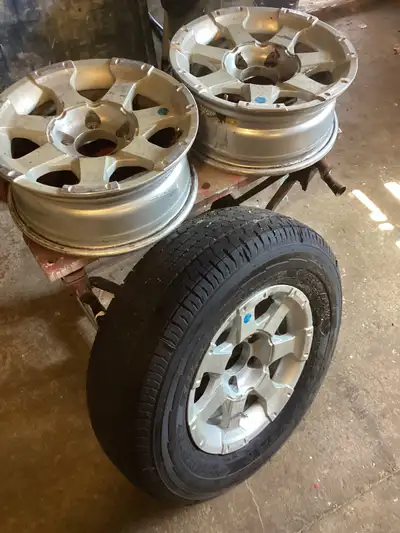 Aluminum 5 hole 205/75R14, 2 rims without tires, one rim with good Goodyear tire