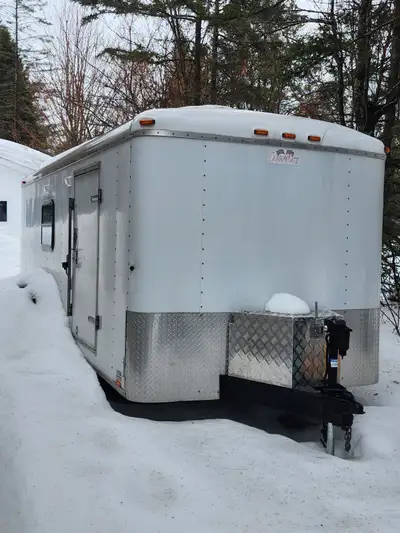 Here is a 2004 Cargo mate 7x18 enclosed trailer converted into a camping/ hunting trailer. Unit was...