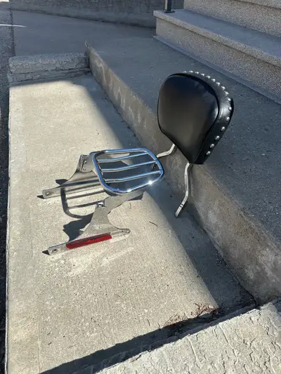Chrome backrest with small luggage rack rack. Came off a 2006 FXST Harley Davidson Softail.