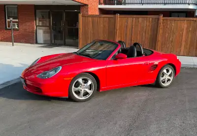 Silver and black cars are nice, but the Guards red is seldom seen and looks great. Black leather int...