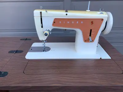 Vintage Singer sewing machine, View more