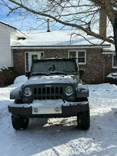 2 door jeep wrangler, with a 6 speed transmission and a 3.6L roughly 256k kms. 3" lift, new battery,...