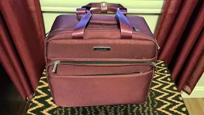 LUGGEX under seat carry on luggage with wheels in burgundy. 16" soft sided small carry on, good for...