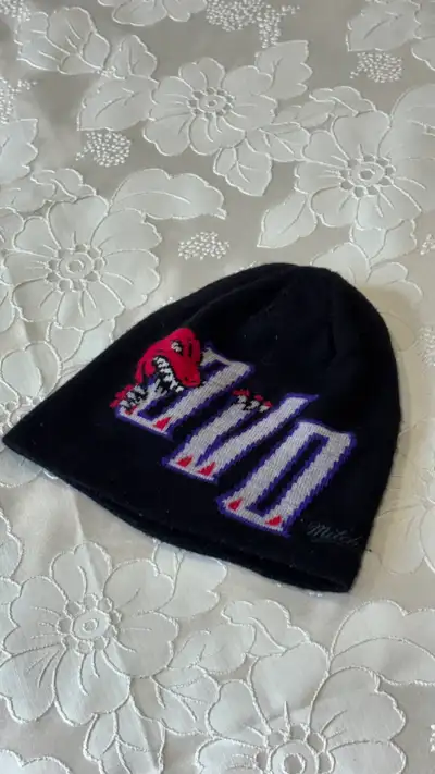 Selling an authentic OVO x Mitchell & Ness Toronto Raptors beanie in black. Features the retro '95 R...