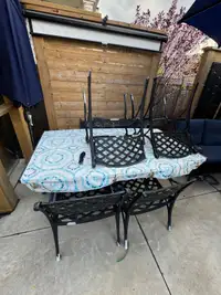 Cast Iron Table and 6 Chairs -Pending pick up 