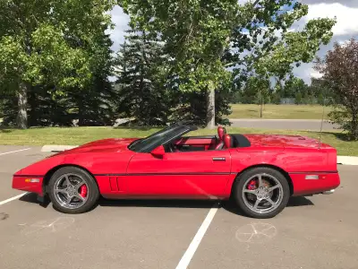 Fully loaded, excellent condition has red exterior and red leather interior, black top. Only had 2 p...