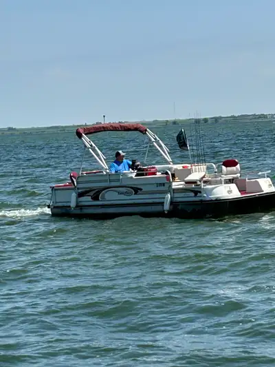 1997 Landau 20ft pontoon boat with 2007 60 HP Suzuki 4 stroke motor Great condition and well cared f...