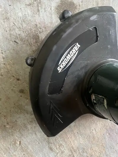 Yardworks electric string trimmer for yard maintenance. It's a corded model.