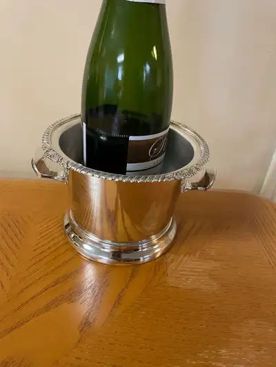 Vintage (circa 1950’s) silver wine bottle cooler. Some wear on the interior removable support. No de...