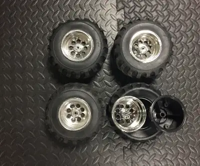 Set of 4. Got this in a trade. Never ended up using/mounting them. Chrome rims. Tires appear to have...