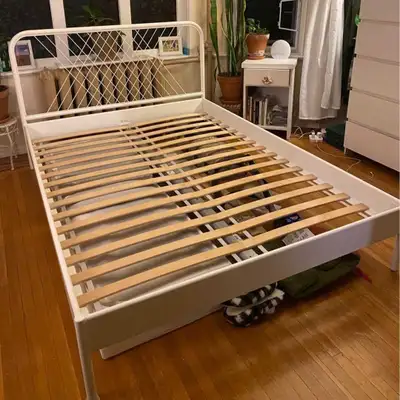 Double/Full Size bed frame for sale. Comes with wooden slats. Box spring is not needed. Mattress Als...